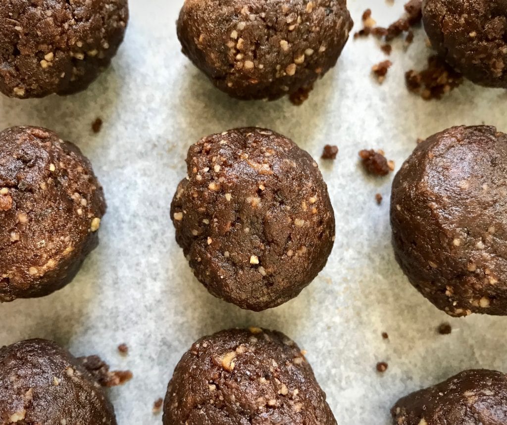 No-bake salted chocolate coffee energy balls on parchment paper